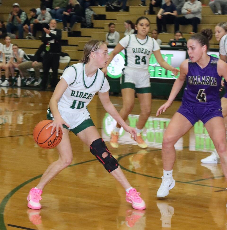 Dave Logan/for Peninsula Daily News 
Port Angeles’ Teanna Clark is guarded by Onalaska’s Renzy Marshall during the Roughriders’ 74-52 loss to the Loggers.