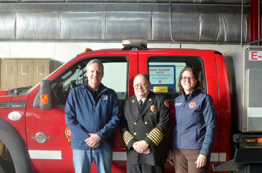 From left, state Public Lands Commissioner Dave Upthegrove, Quilcene Fire Rescue Chief Tim Mckern and Quilcene Fire Rescue Commissioner Marcia Kelbon. (Elijah Sussman/Peninsula Daily News)