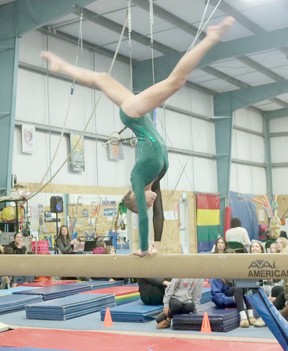 Port Angeles freshman Elyse Brown competes in the Roughriders’ Olympic League home gymnastics meet at the Klahhane Gymnastics Center in Port Angeles on Monday. Brown finished first in the all-around and the Port Angeles team took third overall against Kingston, Bainbridge and North Kitsap. Sequim freshman Sequim Freshman Emily Bair placed seventh in the floor exercise and Port Angeles’ Ryah Deleon was ninth on the floor. Coach Elizabeth DeFrang also said sophomores Mya Callis and Denise Galvan performed their best routines all season. The last league meet of the year is Jan. 30 at Bainbridge. (Dave Logan/for Peninsula Daily News)