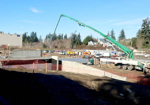 Construction is in the early stages at the new Hurricane Ridge Middle School in Port Angeles. A special cement delivery vehicle brings another batch for the school’s foundation. (Dave Logan/for Peninsula Daily News)