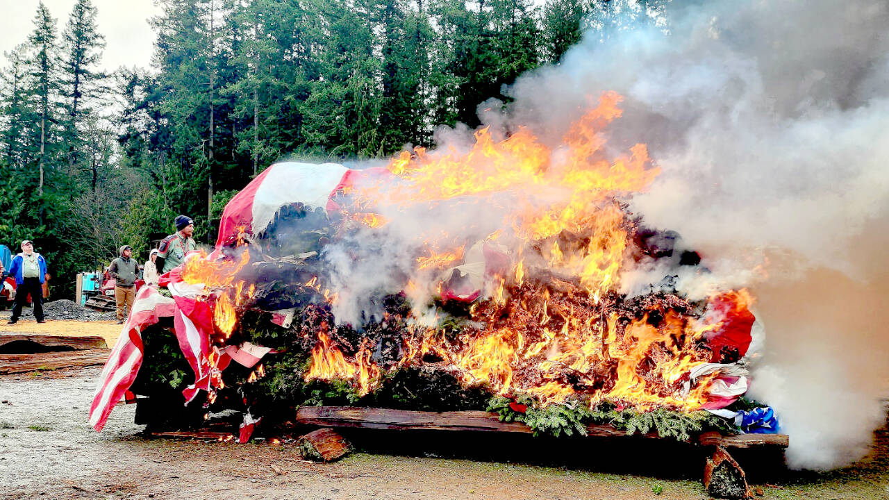 The Michael Trebert Chapter of the Daughters of the American Revolution, assisted by Trail Life USA and Heritage Girls, retired 1,900 U.S. flags and 1,360 veterans wreaths during a recent ceremony. The annual event also involved members of Carlsborg Veterans of Foreign Wars Post #6787, Sequim American Legion Post 62, Port Angeles Elks Lodge #353 Riders and more than 100 members of the public.