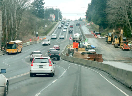 Traffic makes it way through curves just east of Del Guzzi Drive on U.S. Highway 101 at the site of a fish barrier project conducted by the state Department of Transportation. Construction is on hiatus for the winter and is expected to resume in March, WSDOT said. The traffic pattern is expected to be in place until this summer. (Dave Logan/for Peninsula Daily News)