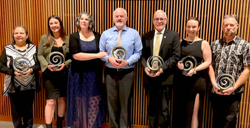 Port Angeles Community Award recipients gather after Saturday night’s annual awards gala. From left, they are Frances Charles, Lower Elwha Klallam Tribe, Organization of the Year; Kyla Magner, Country Aire, Business of the Year; Amy Burghart and Doug Burghart, Mighty Pine Brewing, Emerging Business of the Year; Rick Ross, Educator of the Year; Kayla Fairchild, Young Leader of the Year; John Fox, Citizen of the Year. (Paula Hunt/Peninsula Daily News)